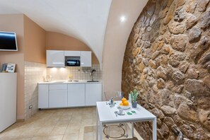 Fridge, microwave, stovetop, dining tables