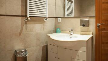 Shower, towels, soap, toilet paper