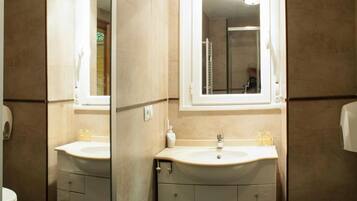 Shower, towels, soap, toilet paper