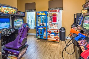 A room with arcade games including 'Carnival', 'Full Court', and 'Stacker'.