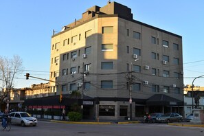 A multi-story building with a flat facade, air conditioning units, and a ground-level entrance. - Gran Hotel Mercedes (Mercedes)