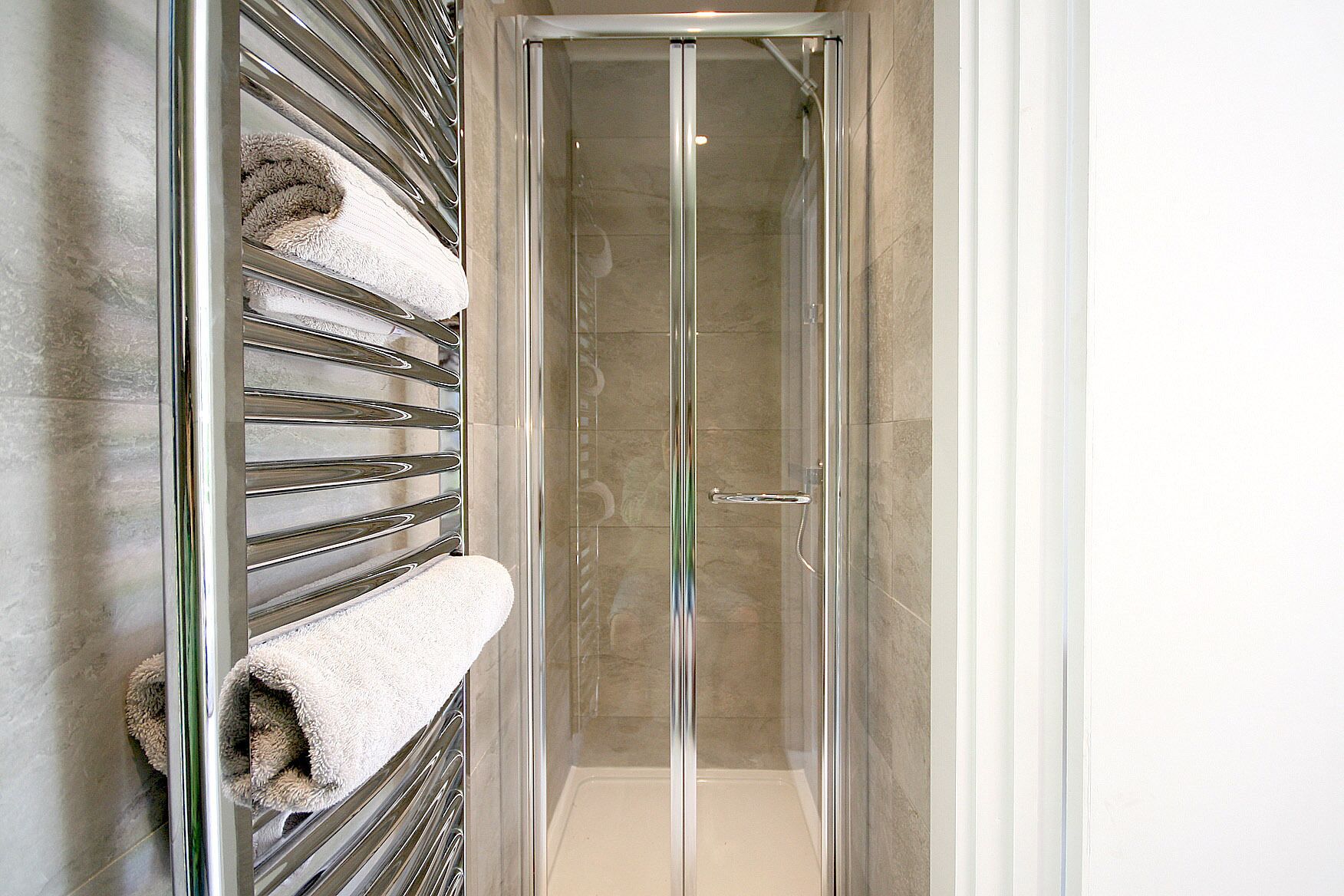 Shower, hair dryer, soap, toilet paper