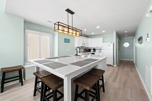 Enjoy cooking in this well-equipped kitchen with a central island and oven.