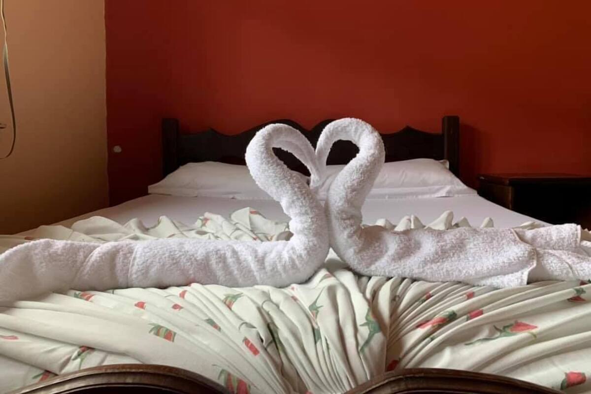 Minibar, desk, bed sheets