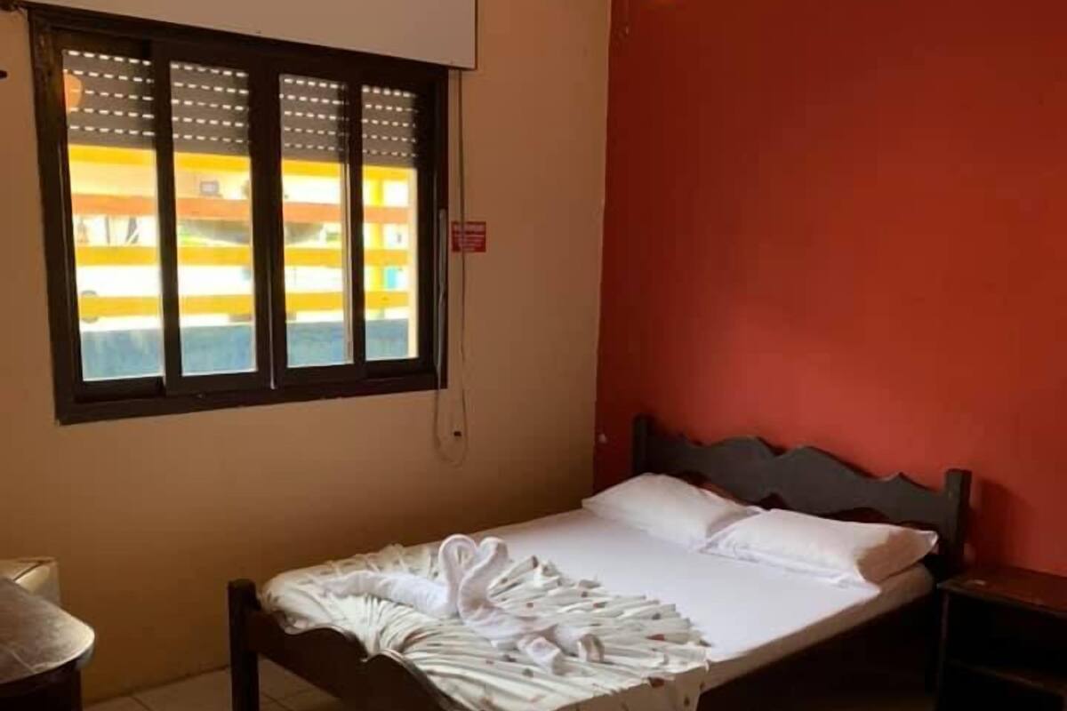 Minibar, desk, bed sheets