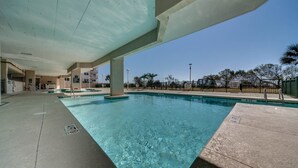 An indoor swimming pool with clear water, concrete flooring, and a covered area with pillars. - 10th floor newly remodeled unit + Free Attraction Tickets! (North Myrtle Beach)