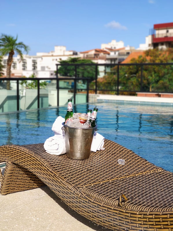 Indoor pool, open 10:00 AM to 10:00 PM, pool loungers