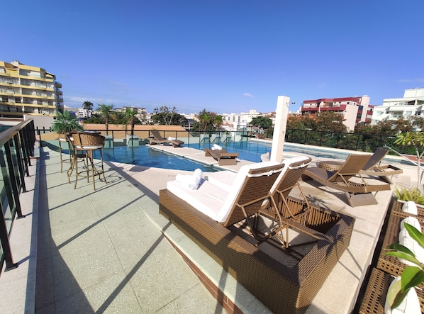 Indoor pool, open 10:00 AM to 10:00 PM, pool loungers