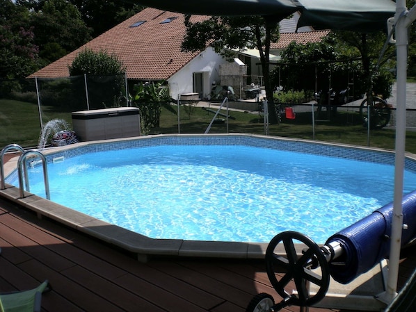 Seasonal outdoor pool, open 10:00 AM to 8:00 PM, pool umbrellas