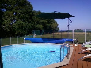 Seasonal outdoor pool, open 10:00 AM to 8:00 PM, pool umbrellas