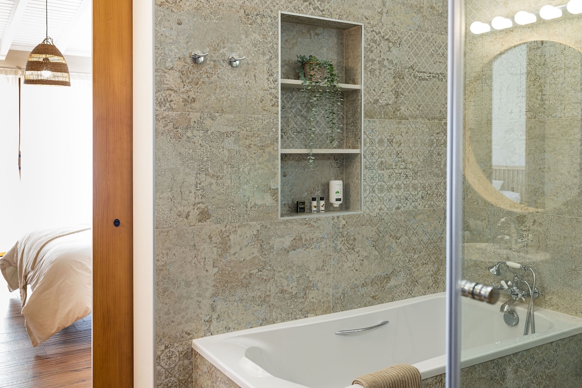 combined shower/bathtub, free toiletries, hair dryer, dressing gowns