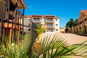 Stunning multi-story building with a central entrance and landscaped courtyard.