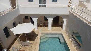 Outdoor pool, pool umbrellas, pool loungers