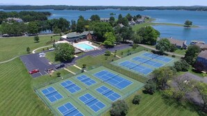 An aerial view of a property with multiple tennis courts, a swimming pool, and a parking area. - Amazing Views and Two Kayaks Ready to Use! (Moneta)