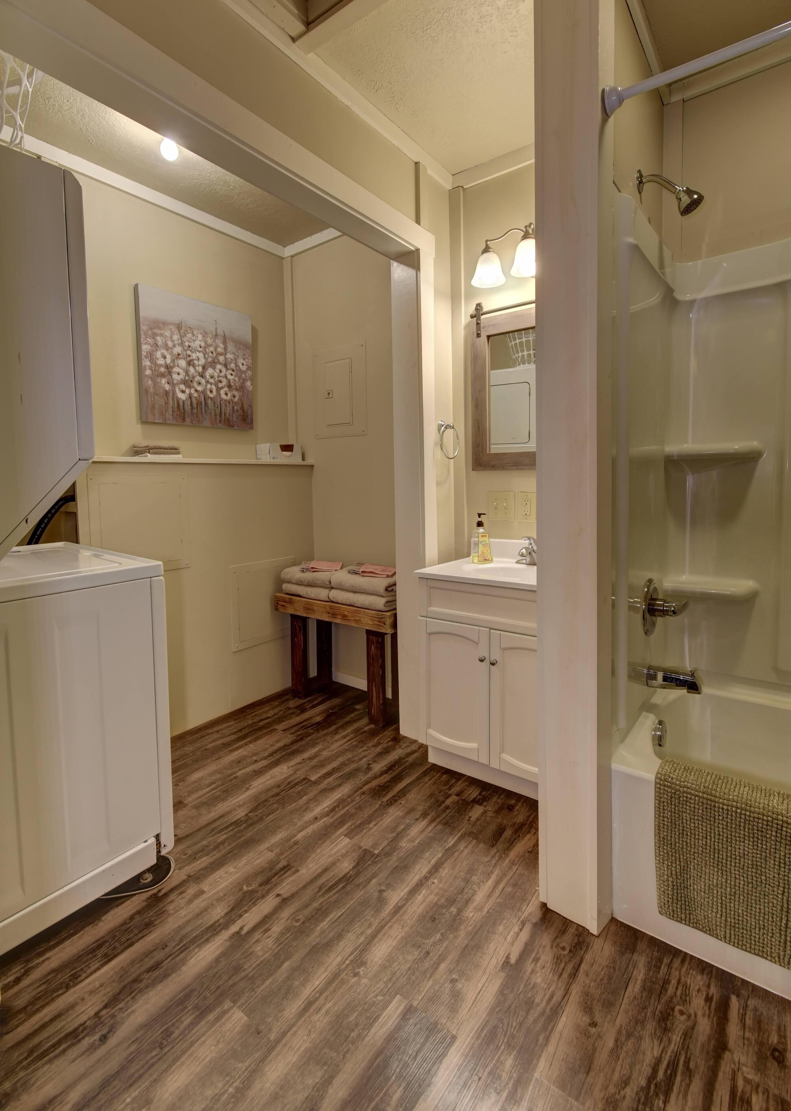 Combined shower/tub, hair dryer, towels, soap