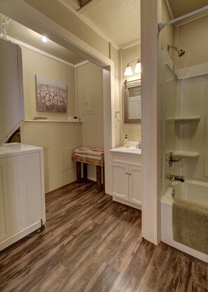 Combined shower/bathtub, hair dryer, towels, soap