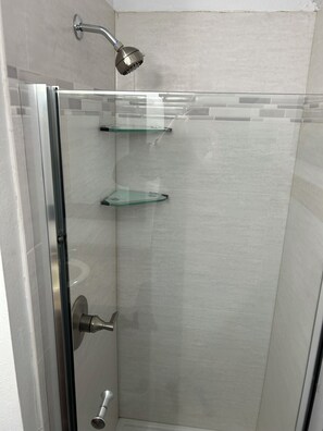 Combined shower/tub, hair dryer, towels, soap
