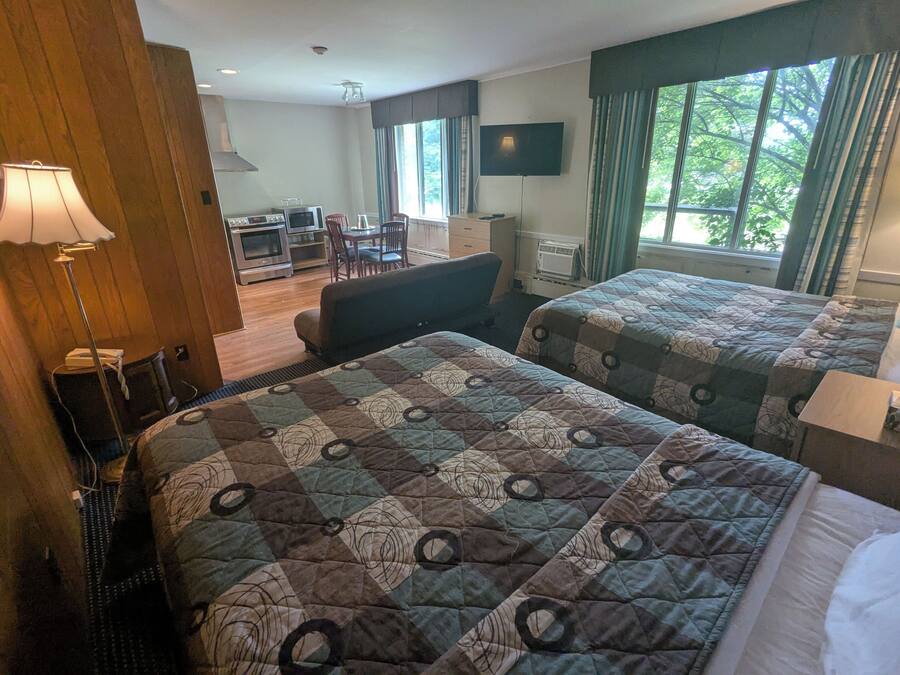 Desk, laptop workspace, blackout drapes, iron/ironing board