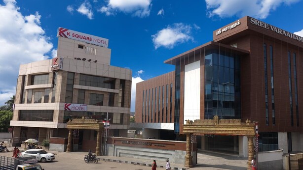 A K Square Hotel and Sree Varaaham building with a clear sky. - Hotel K square (Chennai)