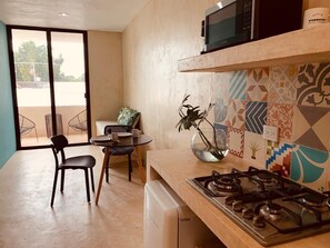 Fridge, microwave, coffee/tea maker, cookware/dishes/utensils