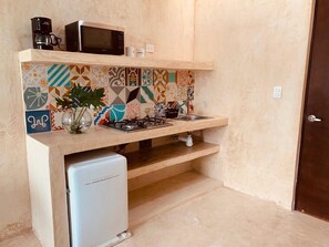 Fridge, microwave, coffee/tea maker, cookware/dishes/utensils