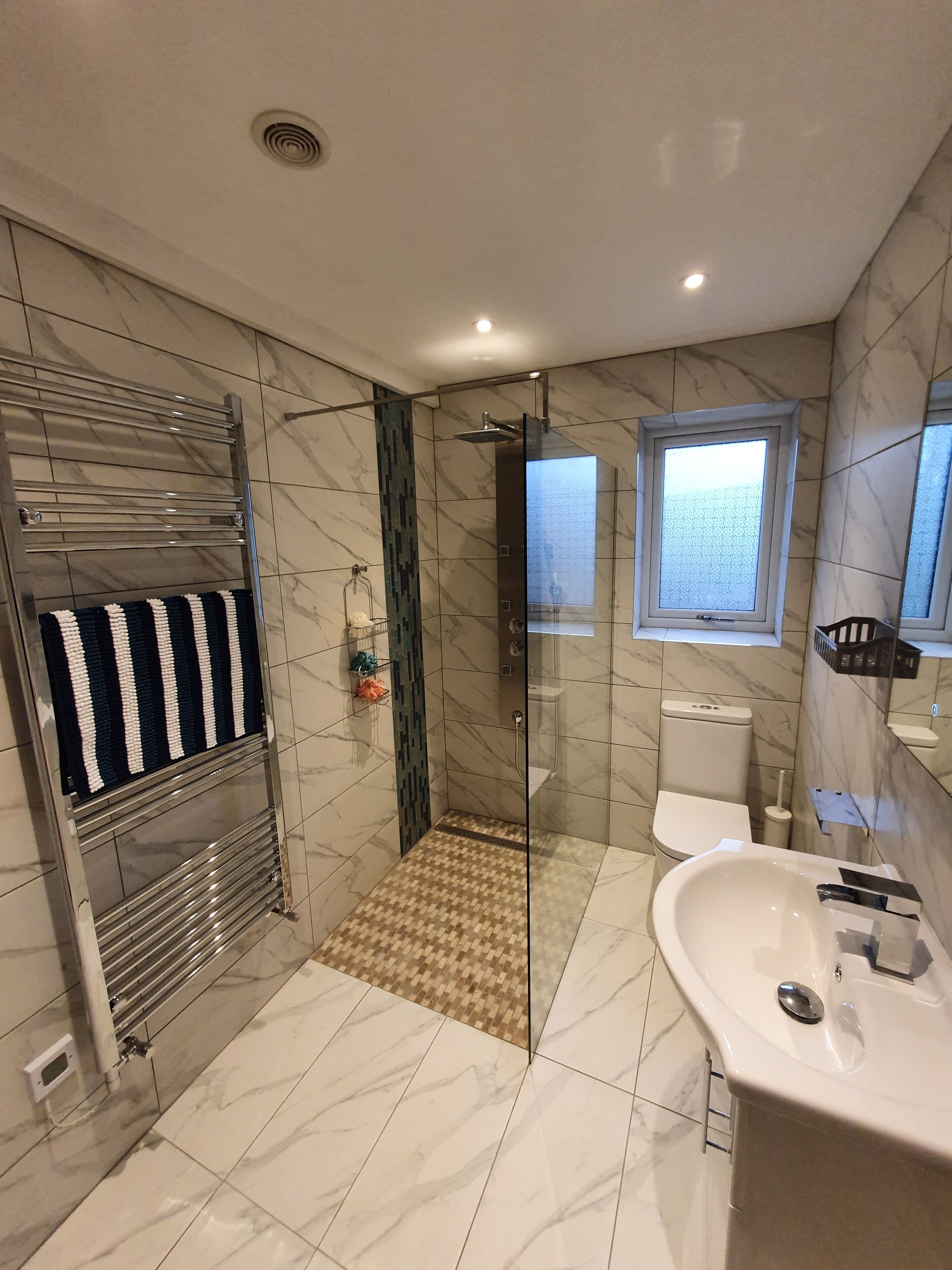 Shower, hair dryer, towels, soap
