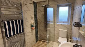 Shower, hair dryer, towels, soap