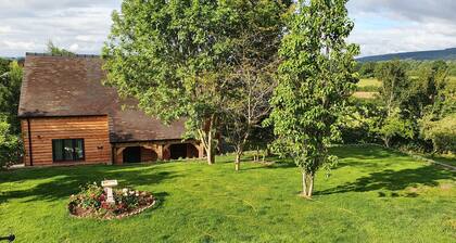 Lovely dog friendly cottage 4 miles from Ludlow with feature oak glass gable.