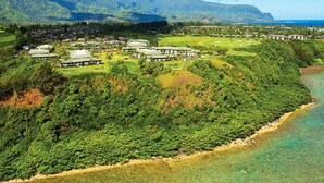 A resort with multiple buildings, lush greenery, and a beach. - Westin Princeville 2 Bedrooms Premium Unit  (Princeville)