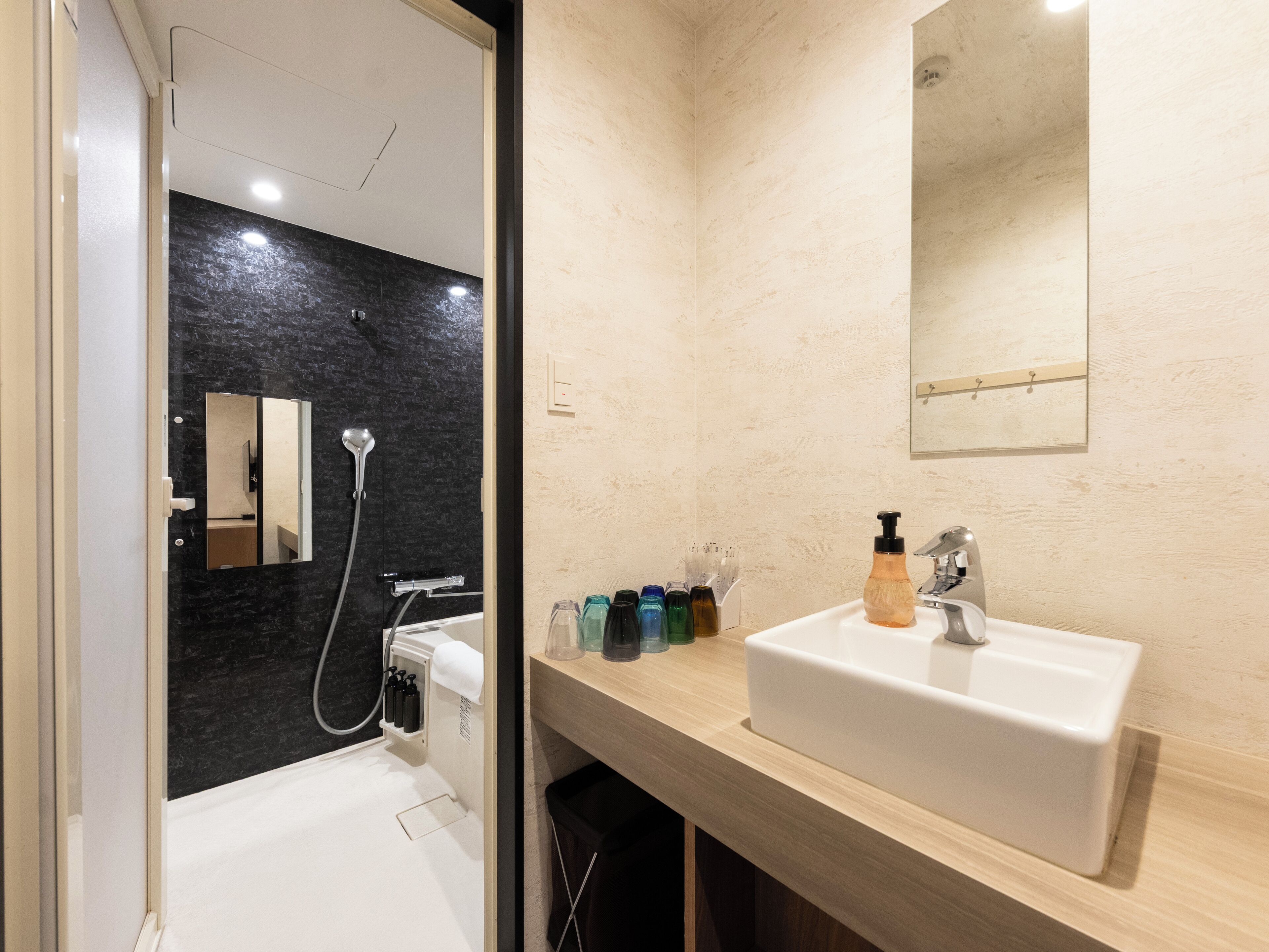family suite room | bathroom | free toiletries, hair dryer, slippers, electronic bidet