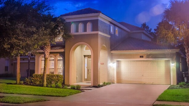 A residential house with a two-story design, a garage, and a well-maintained front yard. - Tigerlilly Private Pool Villa (Davenport)