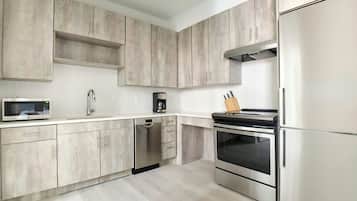 Studio, 1 Queen Bed (Mobility Accessible w/ Roll-in Shower) | Private kitchen | Full-size fridge, electric kettle, toaster, cookware/dishes/utensils