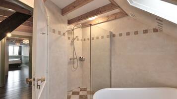 Bathtub, hair dryer, towels, soap