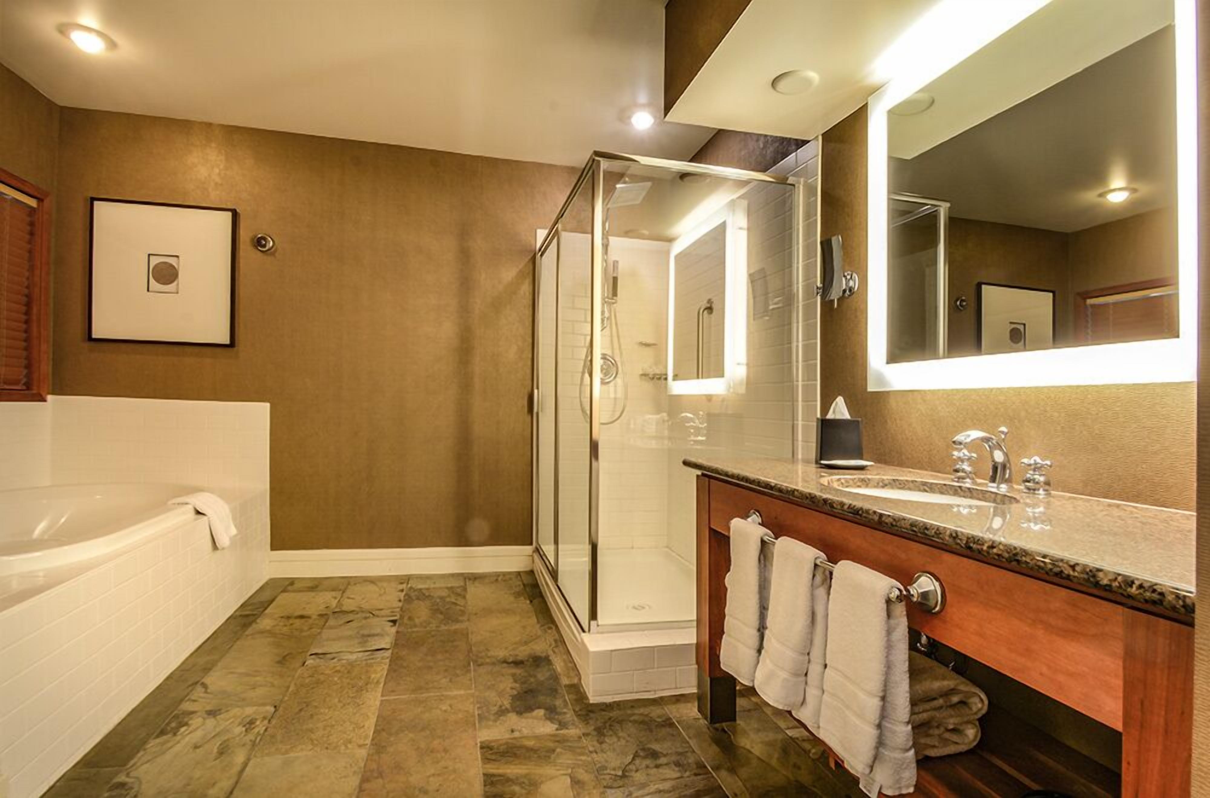 separate bathtub and shower, deep-soaking bathtub, rainfall showerhead