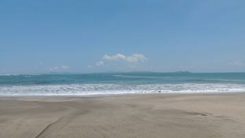 On the beach, sun loungers, beach towels