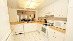 Condo | Private kitchen | Fridge, microwave, oven, stovetop - The Anna Maria Island Beach View 207 (Bradenton Beach)