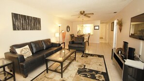 Condo | Living room | Flat-screen TV, fireplace, DVD player - The Anna Maria Island Beach View 207 (Bradenton Beach)