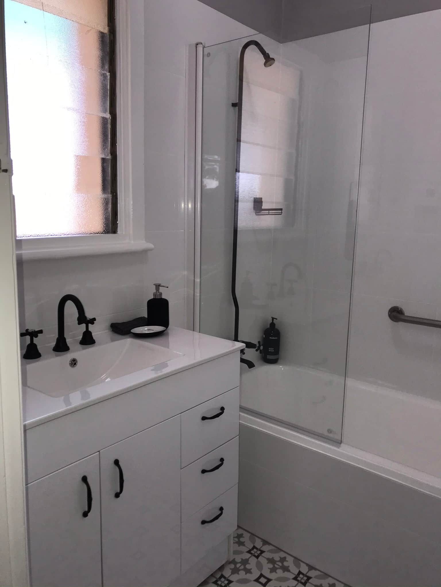 Combined shower/tub, hair dryer, towels, soap