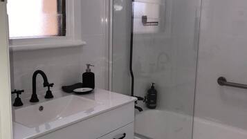Combined shower/tub, hair dryer, towels, soap