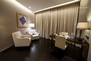 Relax in a stylish room with a comfortable seating area, dining table, and large window.
