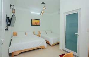 Standard Quadruple Room, City View | Minibar, individually decorated, individually furnished, desk - Van May Homestay Hoian (Da Nang)