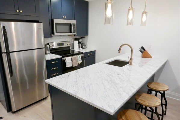 Fridge, microwave, stovetop, coffee/tea maker