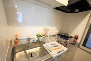 Mini-fridge, microwave, cookware/dishes/utensils