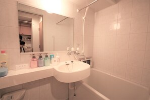 Separate tub and shower, free toiletries, hair dryer, slippers