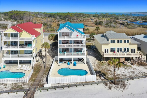 A beachfront property with multiple buildings, a swimming pool, and a beach access area. - Beachfront, Private Pool, Elevator ~ 5 on Beach (Cape San Blas)