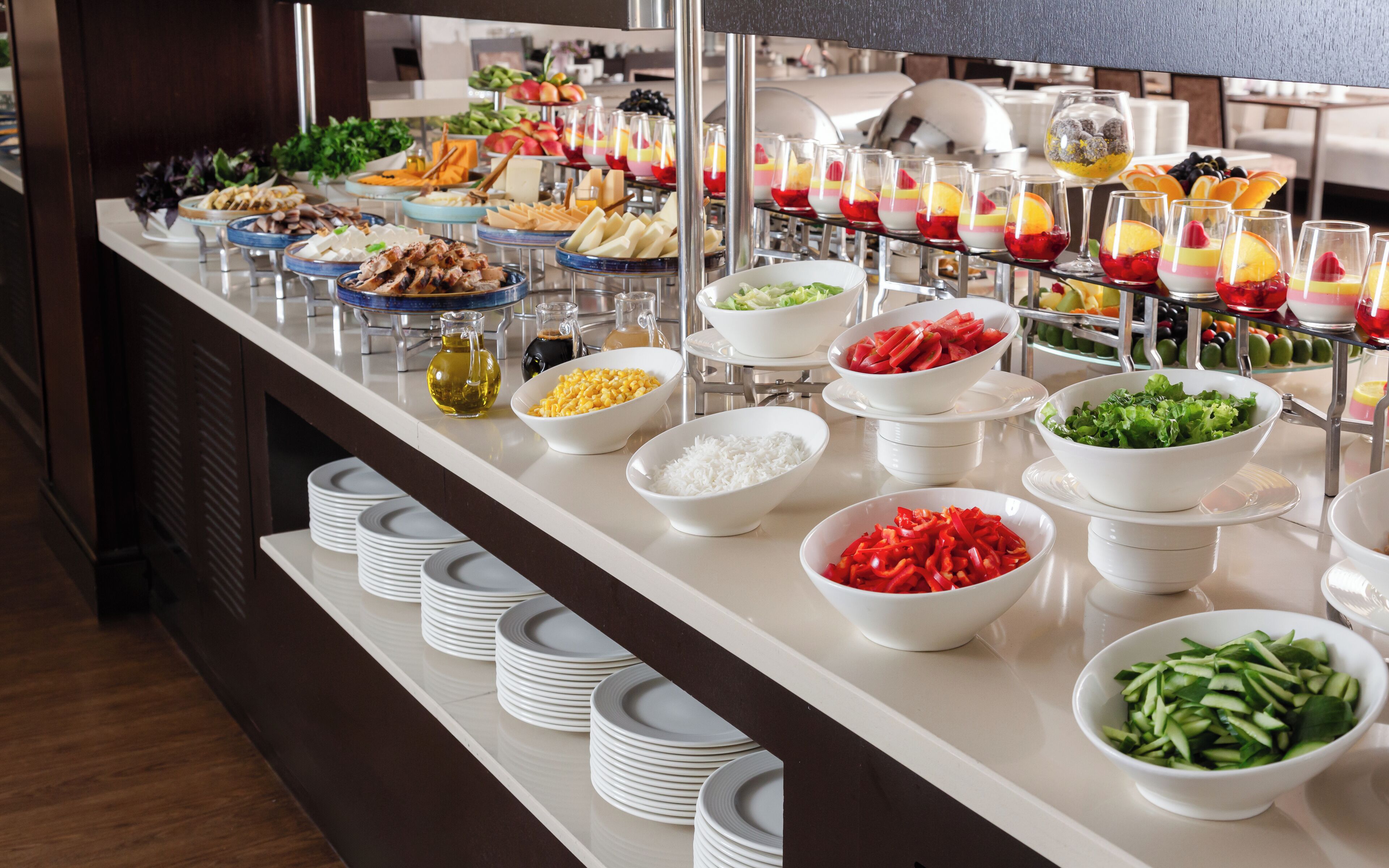 A buffet with various food items and beverages.