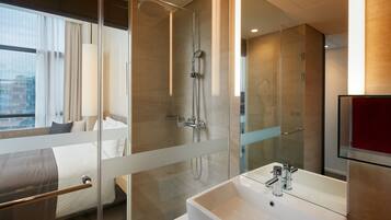 Designer toiletries, hair dryer, bathrobes, slippers