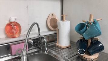 Fridge, microwave, cookware/dishes/utensils, spices