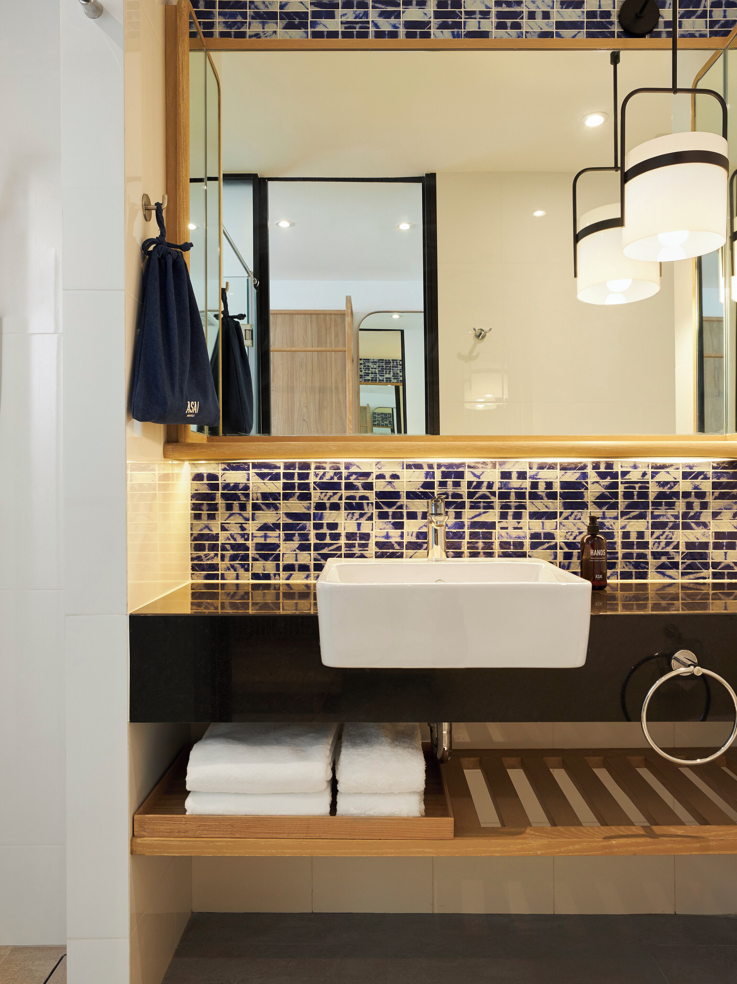 shower, rainfall showerhead, hair dryer, towels