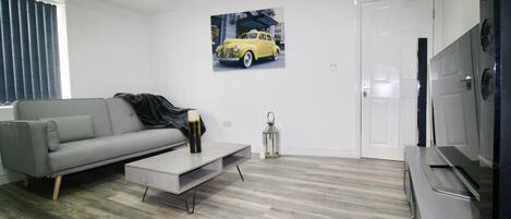 Apartment, 1 Bedroom | Living room | Flat-screen TV